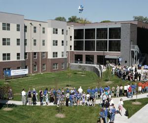 Crowd gathering in celebration of the opening of the Residence Hall